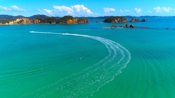 Jet skis cruising by Urupukapuka Island, Bay of Islands